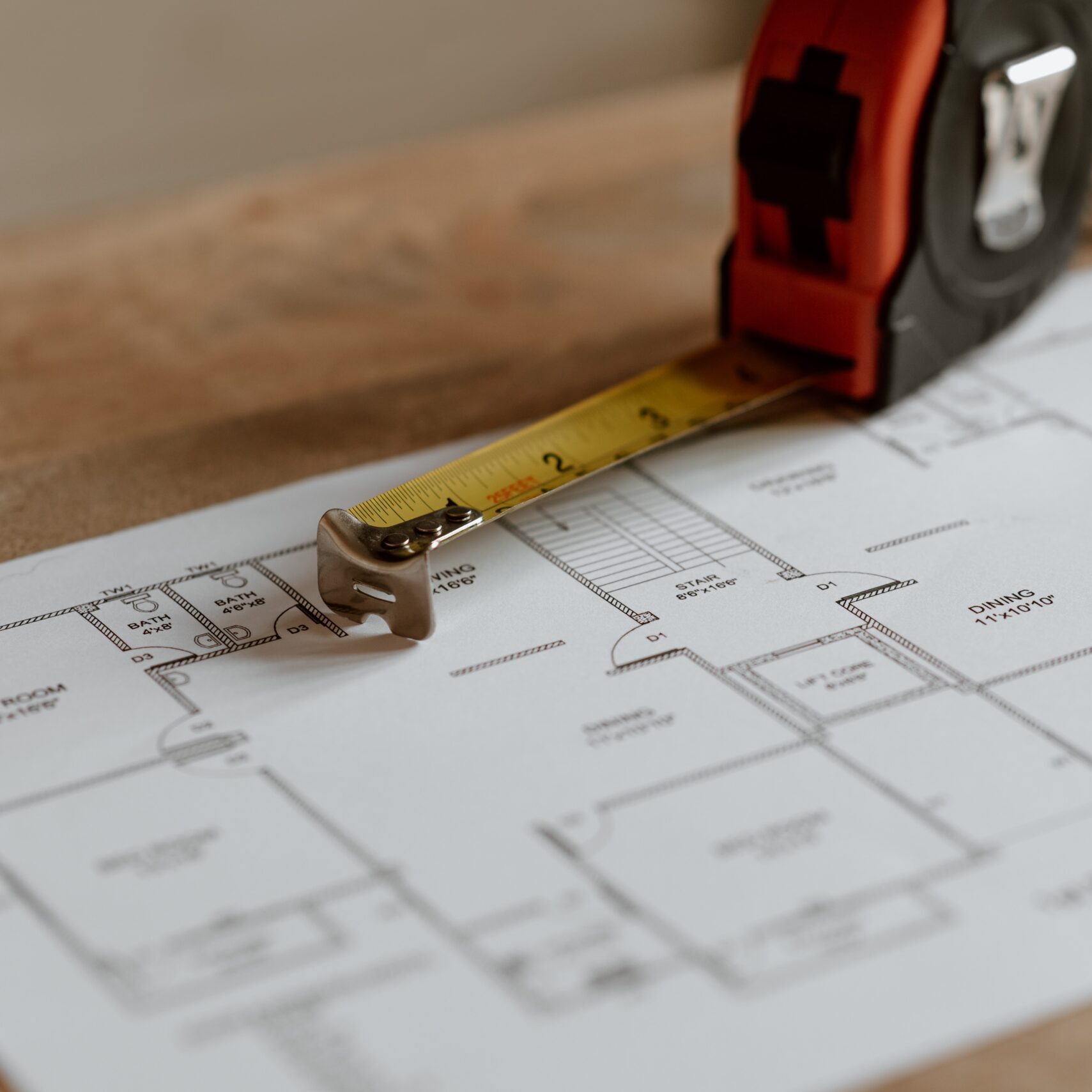 Site plan with pen and tape measurer.