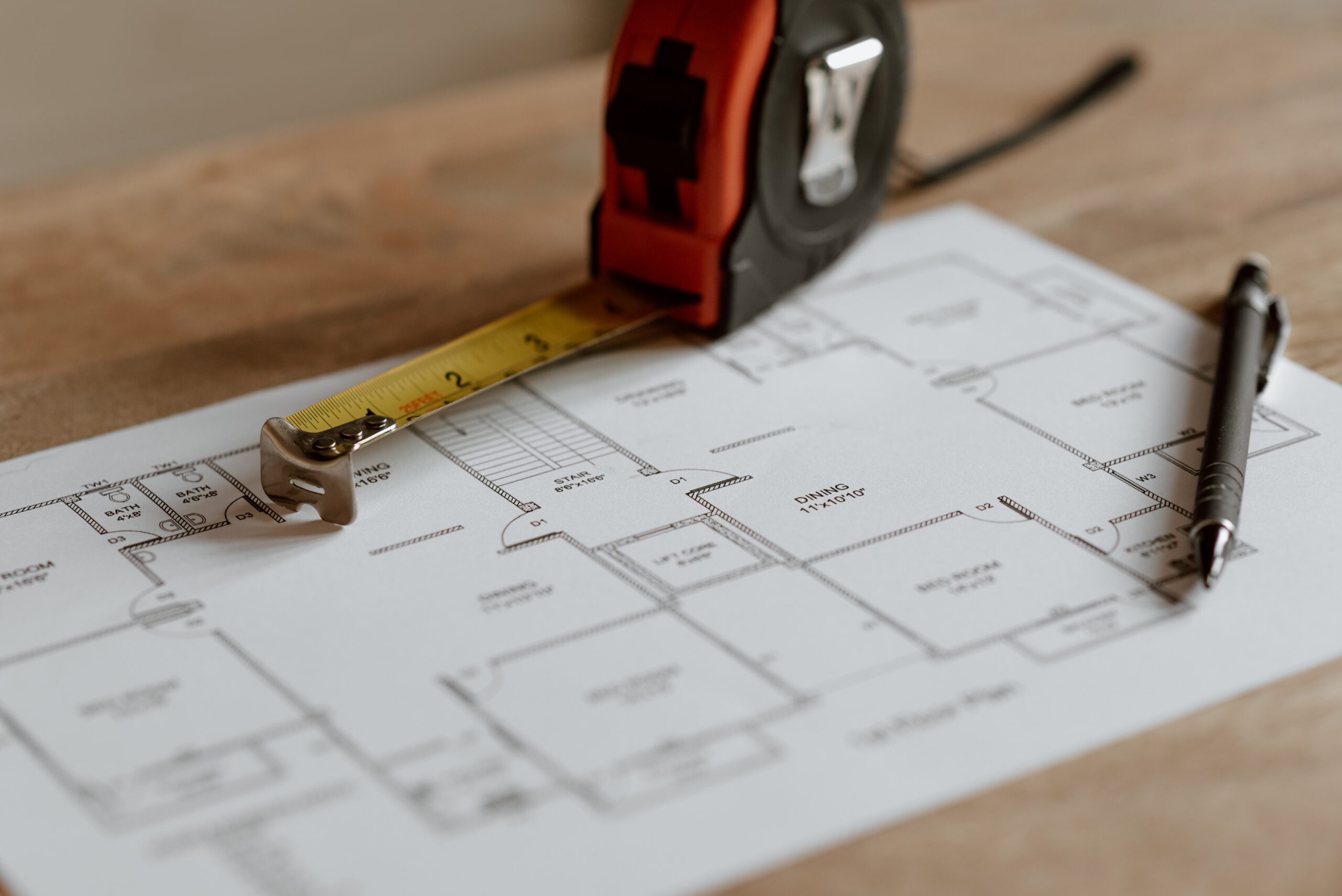Site plan with pen and tape measurer.